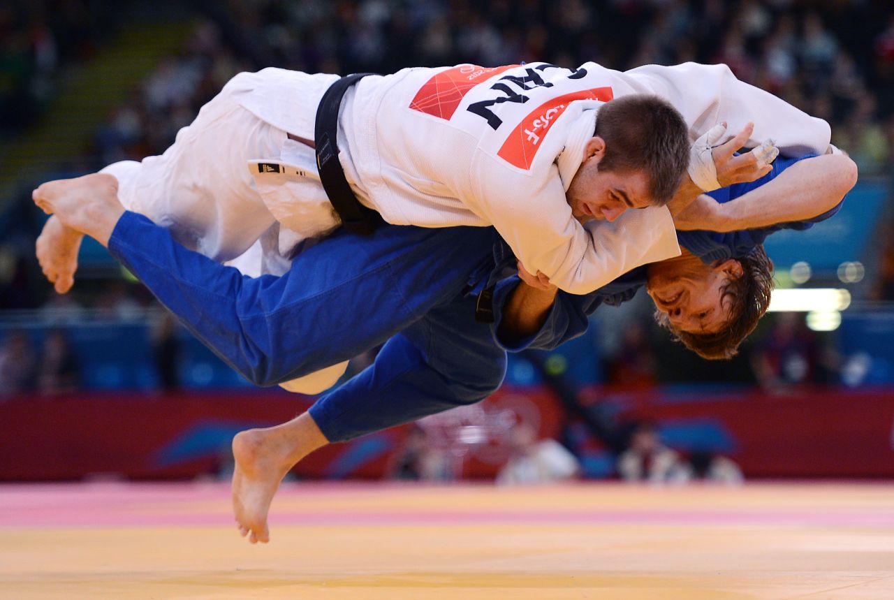Canada's Antoine Valois-Fortier, in white, gets taken down by Russia's Ivan Nifontov during the men's under 81-kilogram quarterfinal judo match on Tuesday.