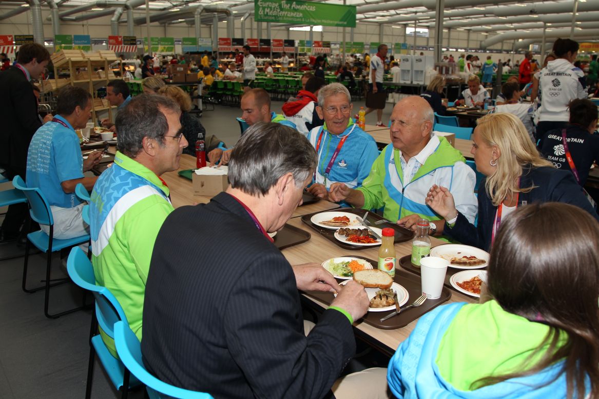 Danilo Turk, the president of Slovenia, visits the dining hall on day one of the London 2012 Olympics.