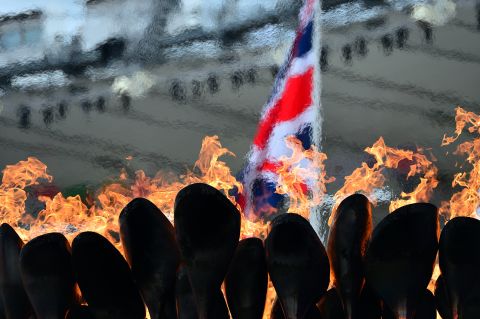 The Olympic flame burns in the cauldron at Olympic Stadium on Tuesday, the fourth day of the Games.