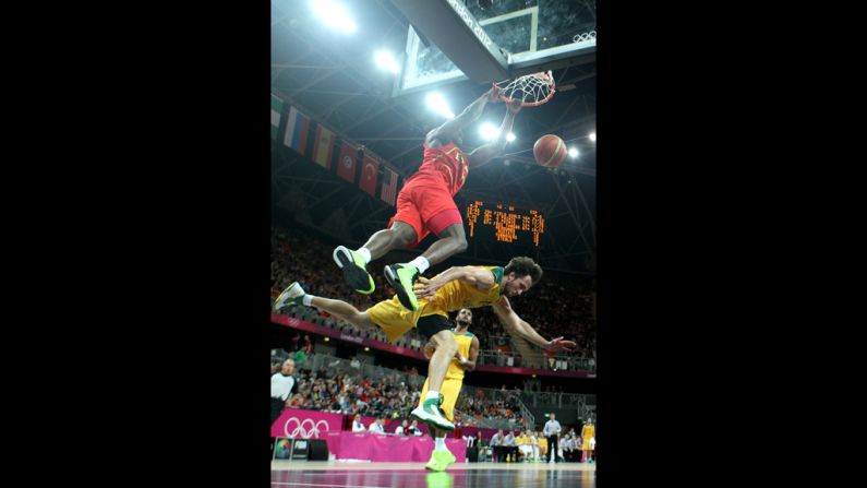 Serge Ibaka of Spain dunks over Matt Nielsen of Australia during a men's basketball preliminary round match Tuesday.