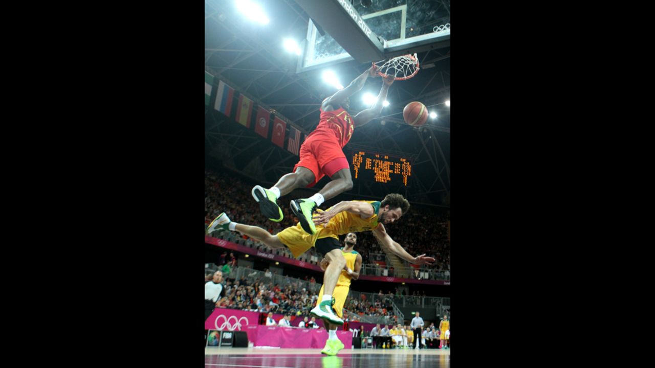 Serge Ibaka of Spain dunks over Matt Nielsen of Australia during a men's basketball preliminary round match Tuesday.