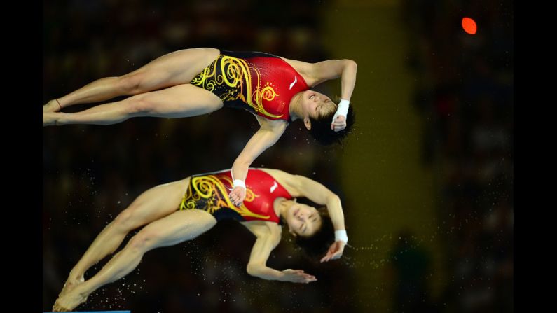 China's Chen Ruolin and Wang Hao compete in the women's synchronized 10-meter platform final. They won a gold for their performance. 