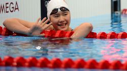 China's Ye Shiwen waves after the finish of the women's 200m individual medley semi-final swimming event at the London 2012 Olympic Games on July 30, 2012 in London. AFP PHOTO / MARTIN BUREAU (Photo credit should read MARTIN BUREAU/AFP/GettyImages) 