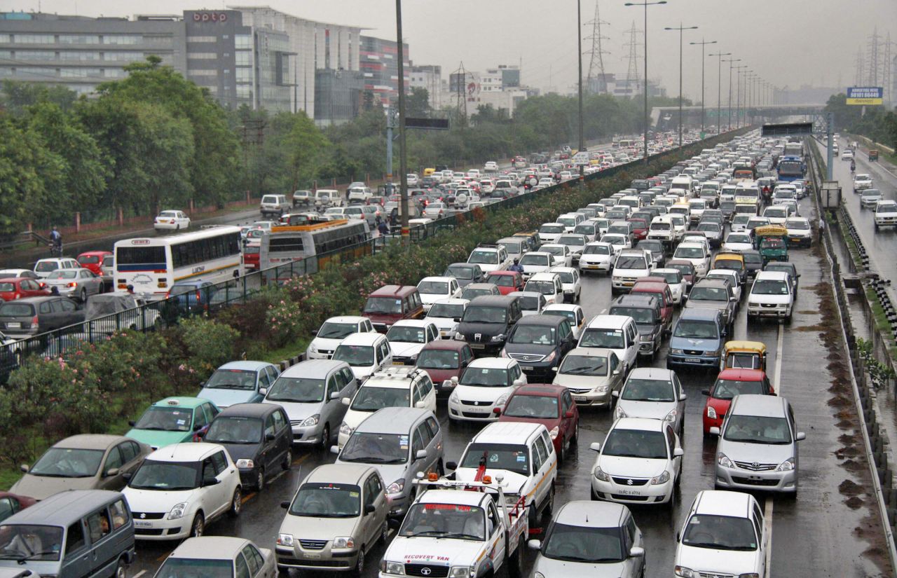 Heavy traffic backs up at a toll gate along a highway on the outskirts of New Delhi as power outages leave half of India without power Tuesday, July 31.