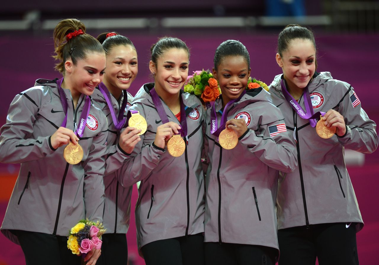 From left, gold medalist U.S. team McKayla Maroney, Kyla Ross, Alexandra Raisman, Gabrielle Douglas and Jordyn Wieber celebrate their gold medal in the women's gymnastics team final on Tuesday. They won the United States' seventh gold medal.