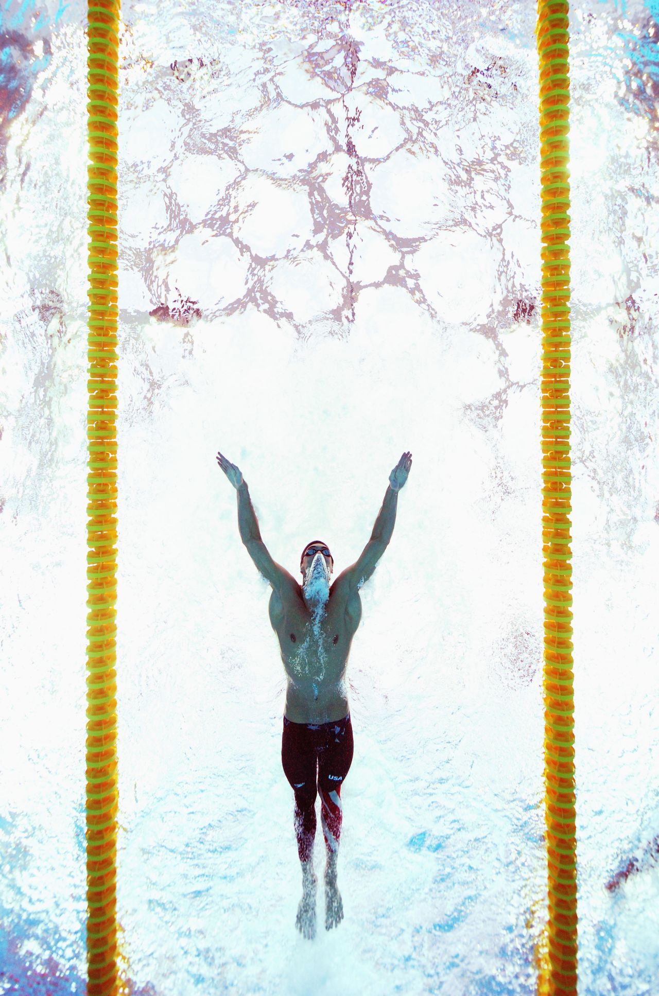 Phelps sets a world record in the 200-meter butterfly in Beijing.