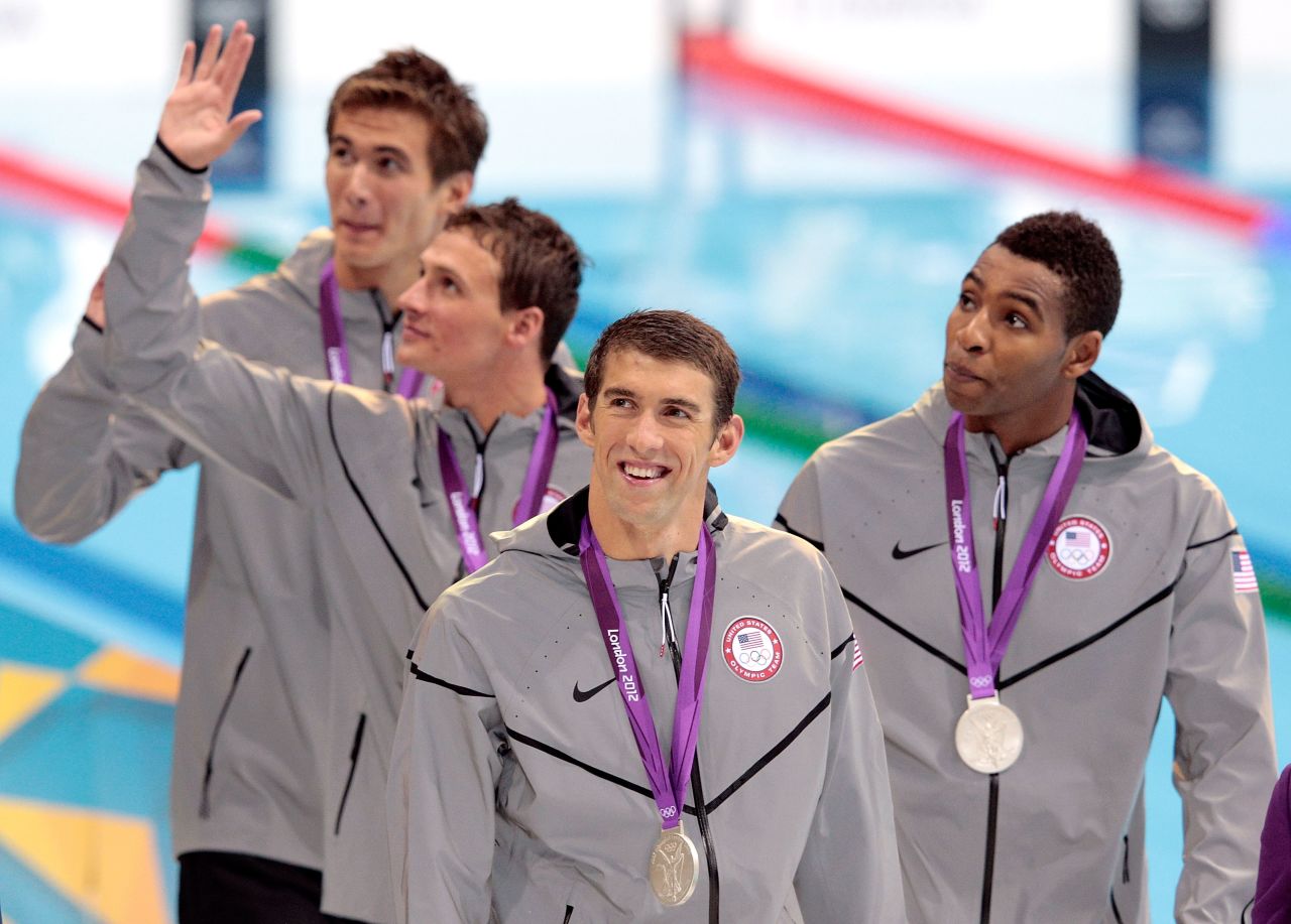 Phelps celebrates with teammates after winning the 4x100 freestyle in London.