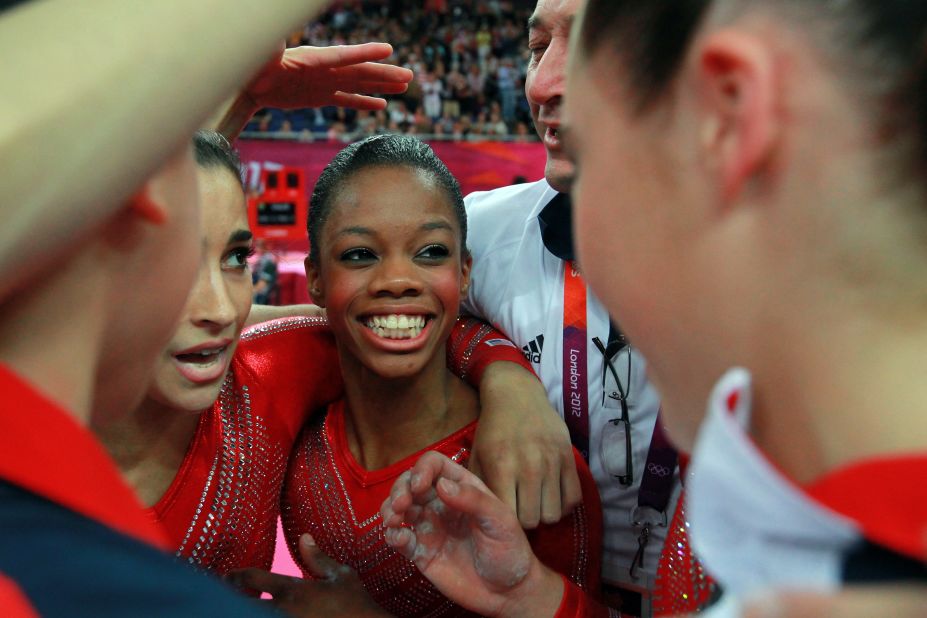 Gabrielle Douglas of the United States celebrates with teammates during the  gymnastics women's team final.