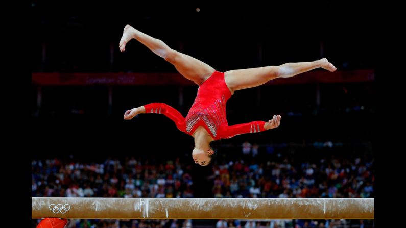 Alexandra Raisman of the United States competes on the balance beam in the  gymnastics women's team final.