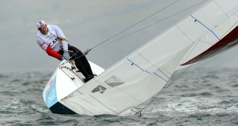 Canada's Tyler Bjorn (shown) and Richard Clarke struggle to keep their keelboat upright in the star sailing class in Weymouth, England.