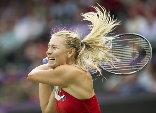 Russia's Maria Sharapova returns the ball to Britain's Laura Robson during their women's singles tennis second-round match.
