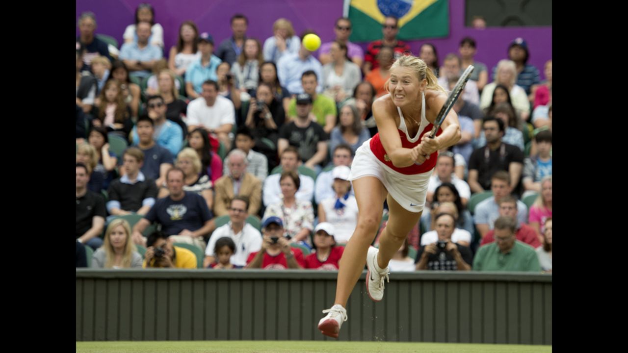 Russia's Maria Sharapova returns to Britain's Laura Robson during their women's singles tennis second-round match.