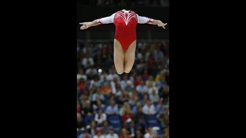 Russia's gymnast Viktoria Komova performs on the beam during the women's team final of the gymnastics event.