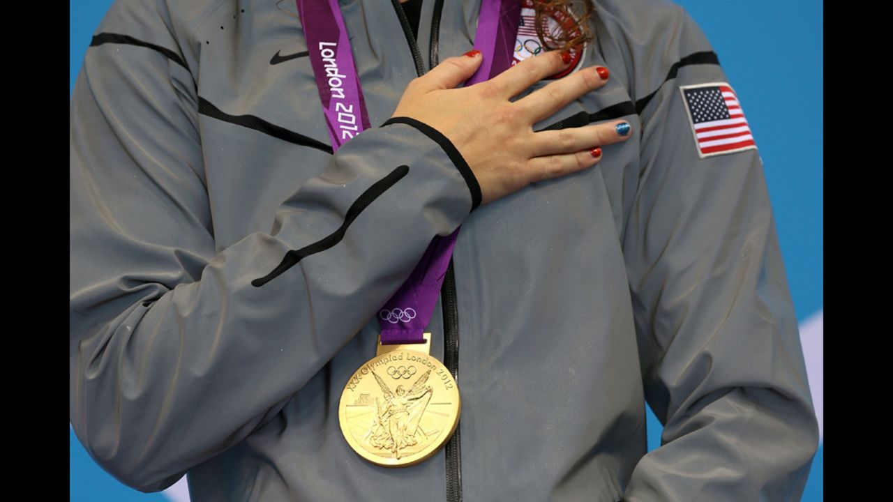 Gold medalist Allison Schmitt poses with her medal. 