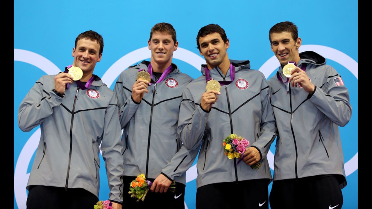From left, gold medallists Ryan Lochte, Conor Dwyer, Ricky Berens and Michael Phelps pose on the podium during the medal ceremony for the Men's 4x200-meter freestyle relay final on Tuesday.