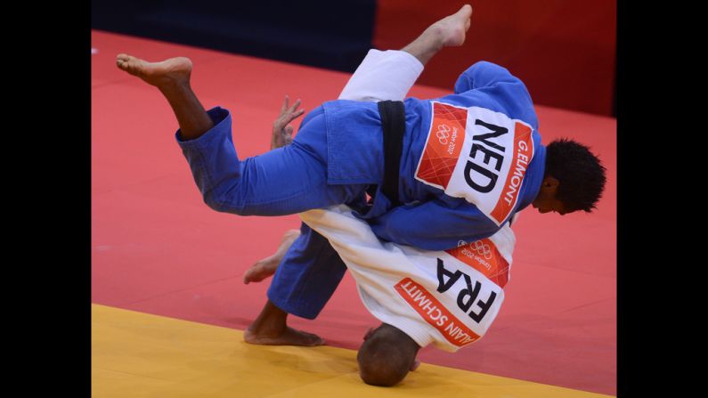 France's Alain Schmitt, in white, competes with the Netherlands' Guillaume Elmont during the men's under 81-kilogram judo contest match Tuesday.