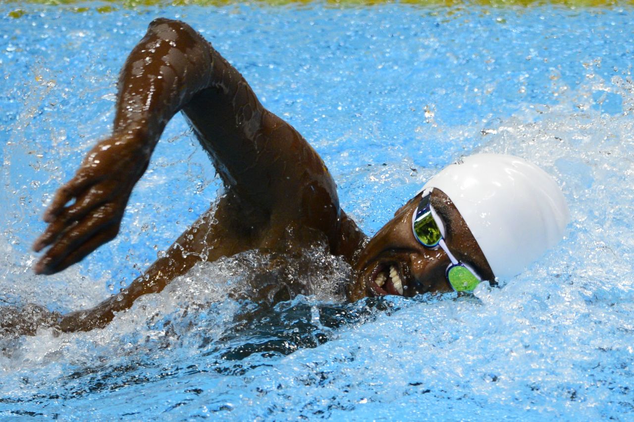 Ahmed Husam of the Maldives competes in the men's 100-meter freestyle heat Tuesday.