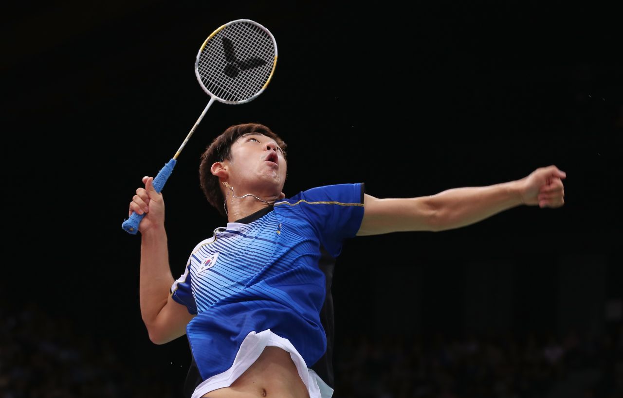 Yong Dae Lee of South Korea takes aim during a mixed doubles badminton match Tuesday.