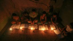 Image #: 18779713    Muslim girls study in the light of candles inside a madrasa or religious school during power-cut in Noida on the outskirts of New Delhi July 30, 2012. Grid failure left more than 300 million people without power in New Delhi and much of northern India for hours on Monday in the worst blackout for more than a decade, highlighting chronic infrastructure woes holding back Asia's third-largest economy. REUTERS/Parivartan Sharma (INDIA - Tags: EDUCATION SOCIETY ENERGY RELIGION)       REUTERS /PARIVARTAN SHARMA /LANDOV