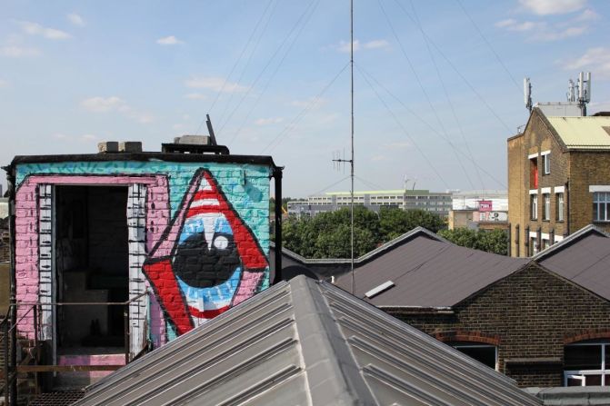 Hackney Wick rooftops. Sweet Toof and Paul insect can be seen in the foreground.  Sweet Toof and Cylops in the distance. Paul Insect is most famous for his 2007 exhibition "Bullion," which was snapped up by Damien Hirst before it opened.