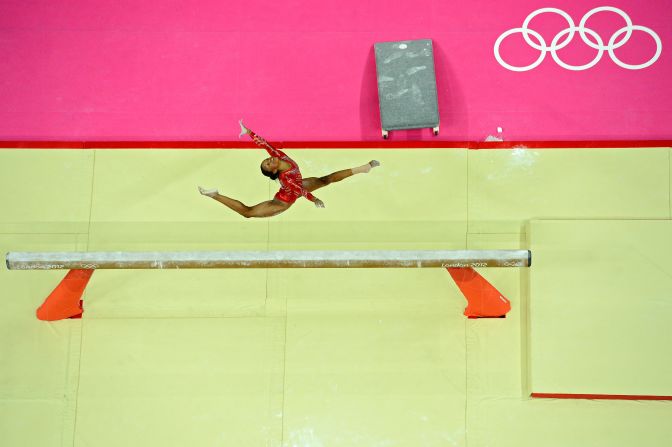 Gabrielle Douglas of the United States performs on the balance beam in the women's gymnastics team final.