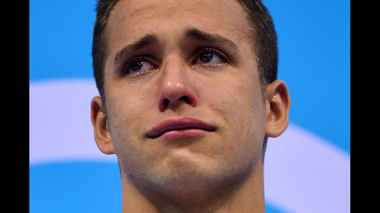 South Africa's Chad Le Clos poses on the podium after taking the gold medal in the men's 200-meter butterfly final.