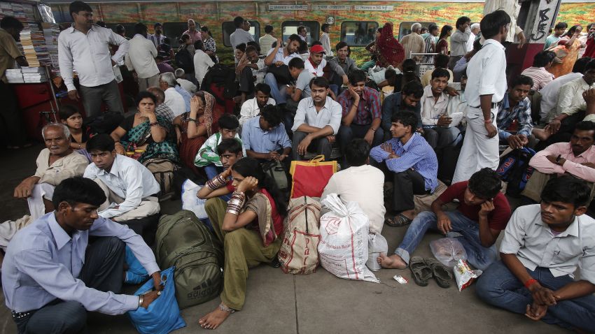 Image #: 18791801    Passengers sit on a platform for their train to arrive as they wait for electricity to be restored at a railway station in New Delhi July 31, 2012. Grid failure hit India for a second day on Tuesday, cutting power to hundreds of millions of people in the populous northern and eastern states including the capital Delhi and major cities such as Kolkata. REUTERS/Adnan Abidi (INDIA - Tags: ENERGY SOCIETY TRANSPORT)       REUTERS /ADNAN ABIDI /LANDOV