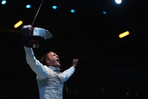 Artur Akhmatkhuzin of Russia celebrates after beating Richard Kruse of Great Britain during a preliminary men's foil match Tuesday.
