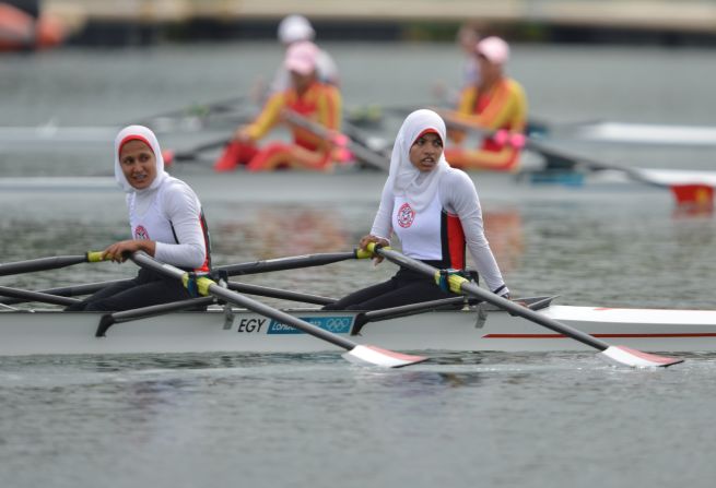 Egypt's Sara Mohamed Baraka, right, and Fatma Rashed rest after competing in the women's rowing lightweight double sculls repechages event Tuesday.
