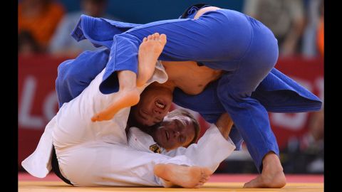 Germany's Ole Bischof, in white, and Islam Bozbayev of Kazakhstan face off in the men's under 81-kilogram judo contest Tuesday.