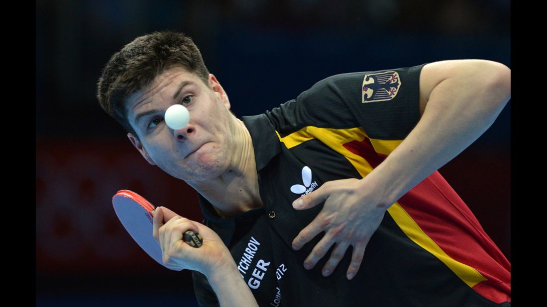 Germany's Dimitrij Ovtcharov eyes the ball before returning a shot to Denmark's Michael Maze in their table tennis men's singles match.