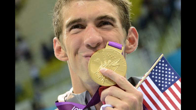 U.S. swimmer Michael Phelps kisses his gold medal after the podium ceremony of the men's 4x200-meter freestyle relay final. Phelps secured a record 19th Olympic medal when the U.S. team won the event Tuesday.