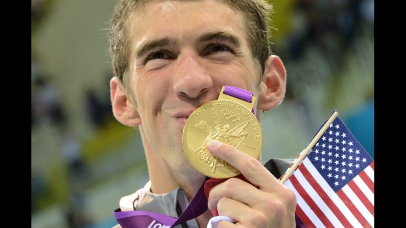U.S. swimmer Michael Phelps kisses his gold medal after the podium ceremony of the men's 4x200-meter freestyle relay final. Phelps secured a record 19th Olympic medal when the U.S. team won the event Tuesday.