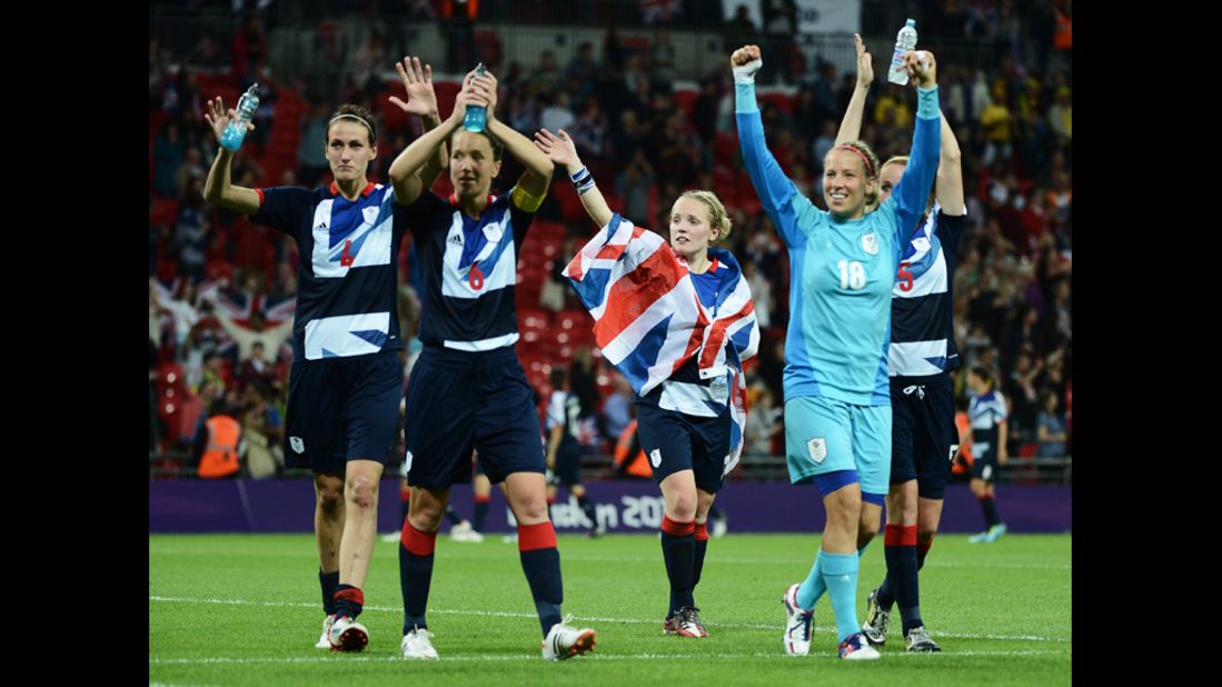 Britain's female football players celebrate their 1-0 win over Brazil.