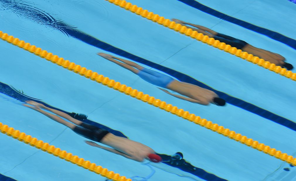 From left, Britain's Andrew Willis, Hungary's Daniel Gyurta and Japan's Kosuke Kitajima compete in the men's 200-meter breaststroke semifinal.