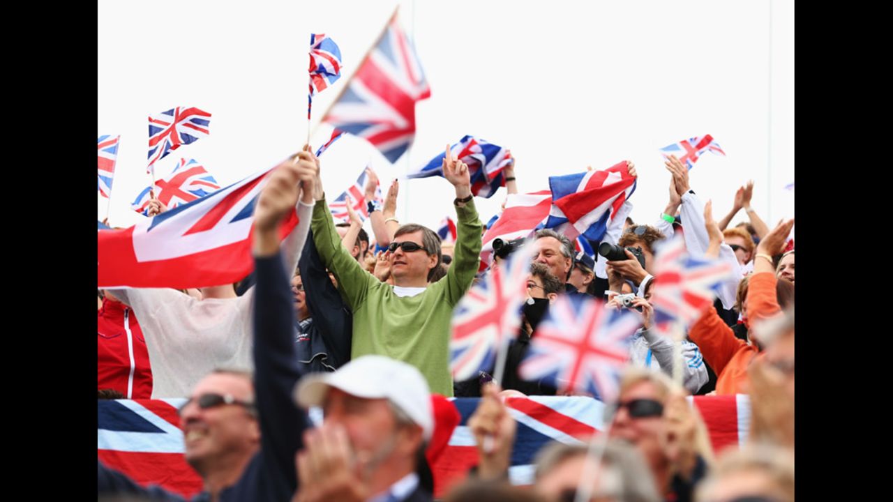 British fans wave Union Jacks as they enjoy the atmosphere at Eton Dorney.