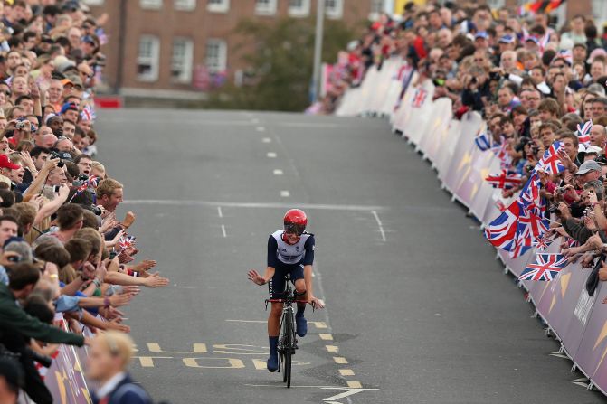 Elizabeth Armitstead of Great Britain waves to the crowds after the women's individual time trial road cycling race.