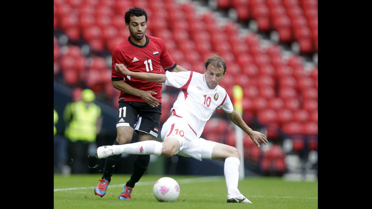 Egypt's Mohamed Salah, left, vies with Belarus' Renan Bardini Bressan during a men's soccer match.