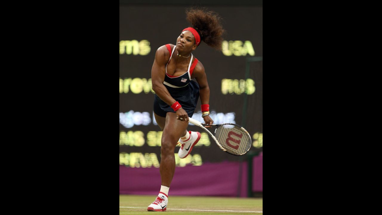Serena Williams of the United States serves to Vera Zvonareva of Russia during the third round of women's singles tennis.