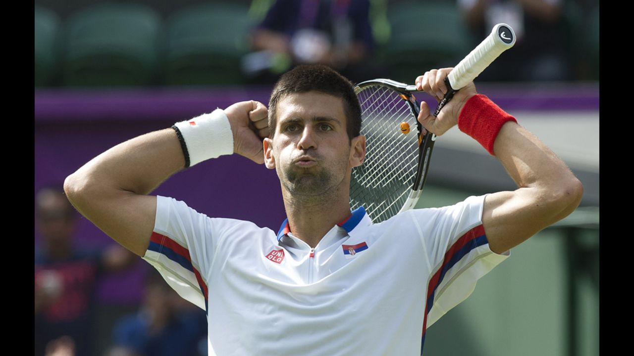 Serbia's Novak Djokovic celebrates after defeating Australia's Lleyton Hewitt in the third round men's singles tennis match.