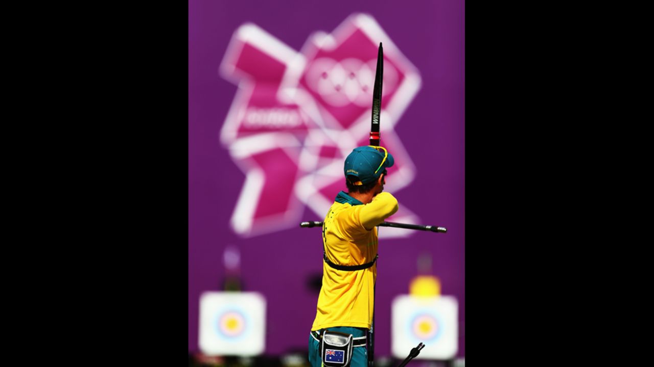 Taylor Worth of Australia competes in an elimination archery match against Brady Ellison of the United States.