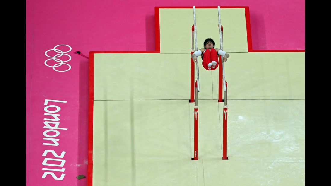 Kohei Uchimura of Japan competes on the parallel bars in the men's individual all-around gymnastics final.