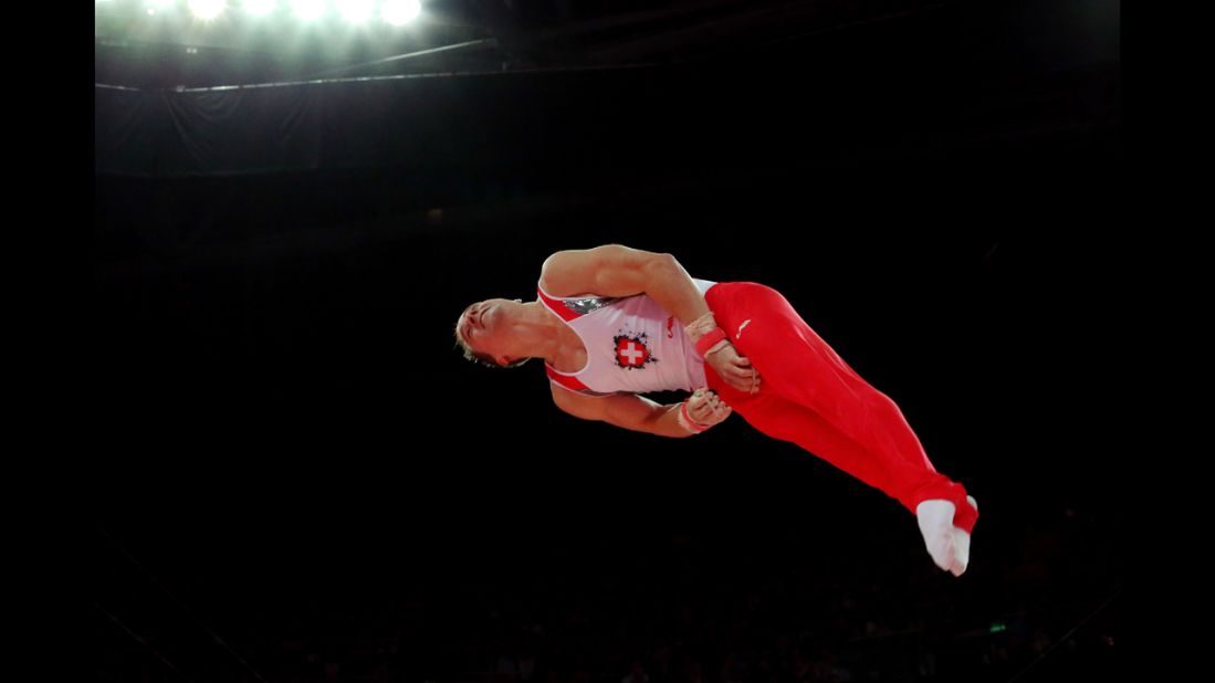 Claudio Capelli of Switzerland competes on the horizontal bar in the men's individual all-around gymnastics final.