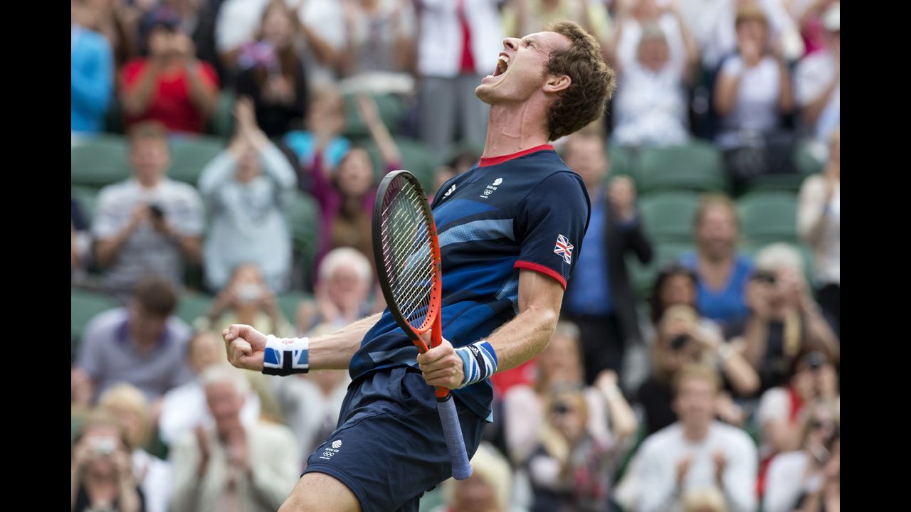 Britain's Andy Murray celebrates after defeating Marcos Baghdatis of Cyprus in their third-round men's singles tennis match.