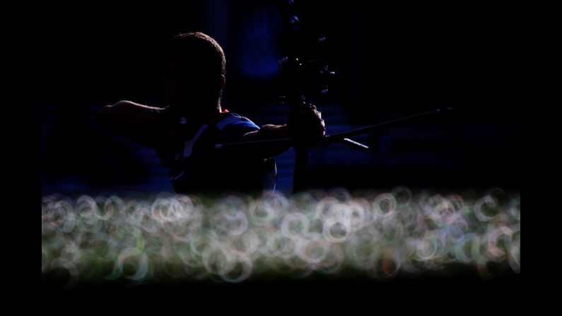 Gael Prevost of France competes in the men's individual archery 1/16 eliminations match against countryman Thomas Faucheron.