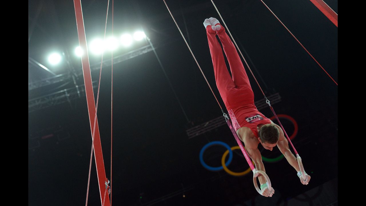 Russia's David Belyavskiy performs on the rings during the men's individual all-around competition of the gymnastics event.
