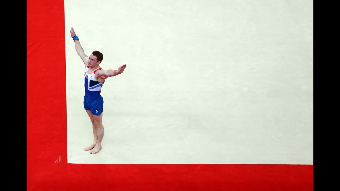 Kristian Thomas of Great Britain performs his floor exercise in the men's individual all-around gymnastics final. 