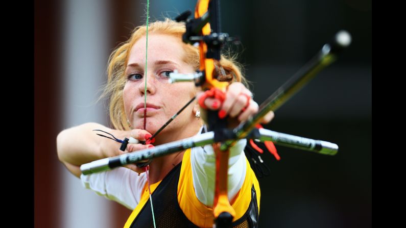 Lidiia Sichenikova of Ukraine competes in the women's individual archery 1/32 eliminations match against Ekaterina Timofeyeva of Belarus.