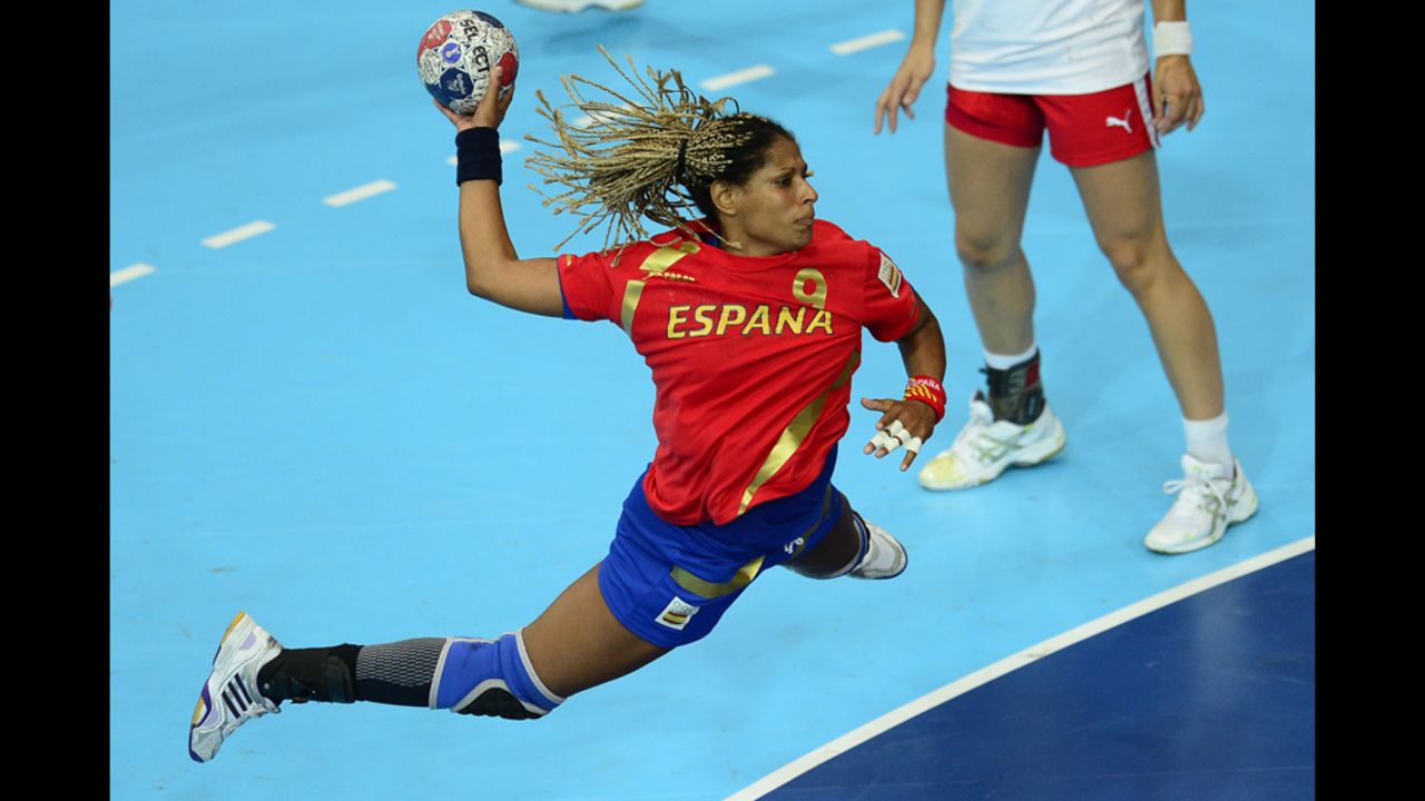 Spain's rightback Marta Mangue Gonzalez jumps to shoot during the women's preliminaries Group A handball match against Denmark.