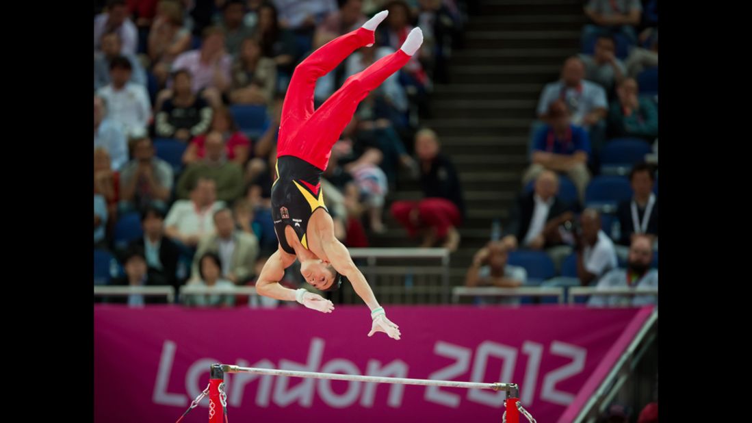 Germany's Marcel Nguyen reaches for the high bar during his silver medal performance in men's individual all-around gymnastics.